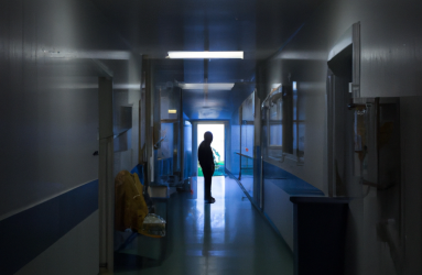 dalle_2023-04-20_12.06.56_-_hospital_hallway_with_light_in_the_end_of_it_and_darker_start_someone_standing_and_looking_to_the_direction_of_the_light.png