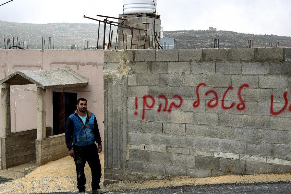 graffiti_settlers_spray-painted_in_hebrew_on_the_wall_of_a_home_in_the_village_of_jalud_nablus_district._photo_by_salma_a-debi_b